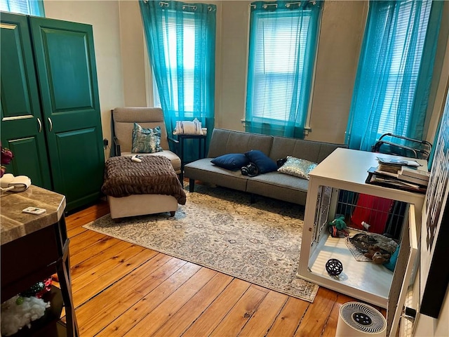 living area with hardwood / wood-style flooring