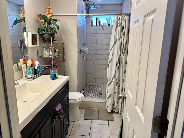 full bath featuring marble finish floor, a shower stall, toilet, and vanity