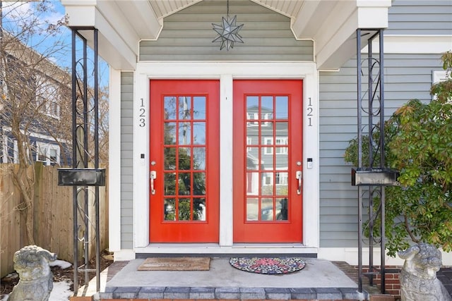 doorway to property with fence