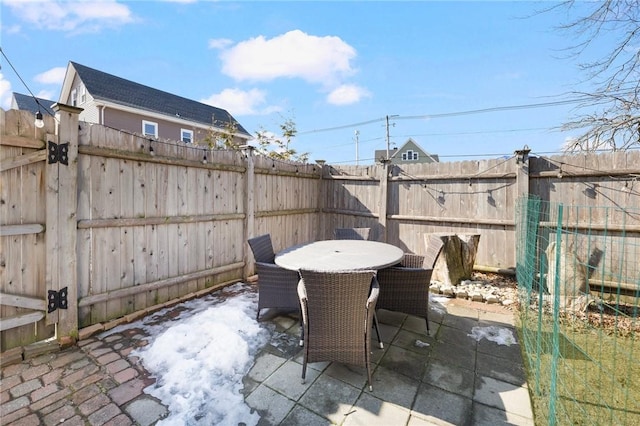 view of patio / terrace featuring outdoor dining space and a fenced backyard