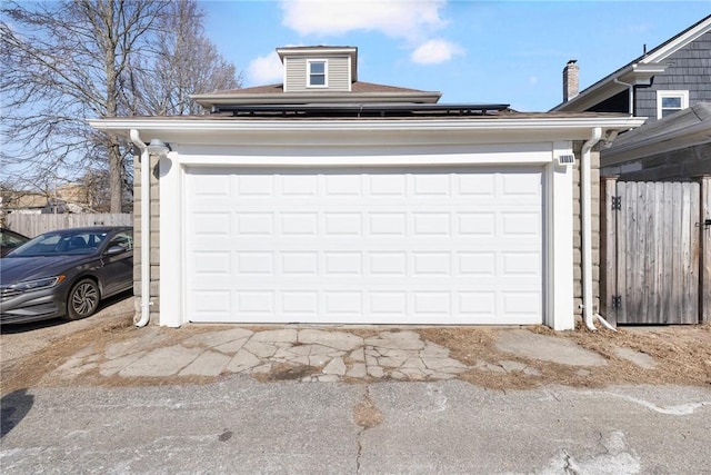 garage featuring fence