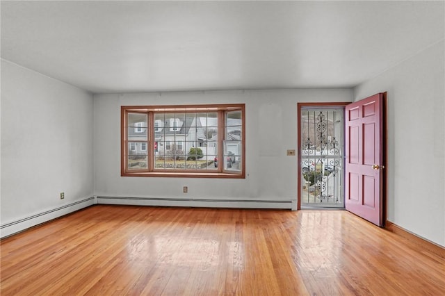 spare room featuring wood-type flooring