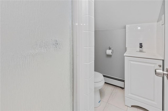 bathroom with baseboard heating, vanity, toilet, and walk in shower