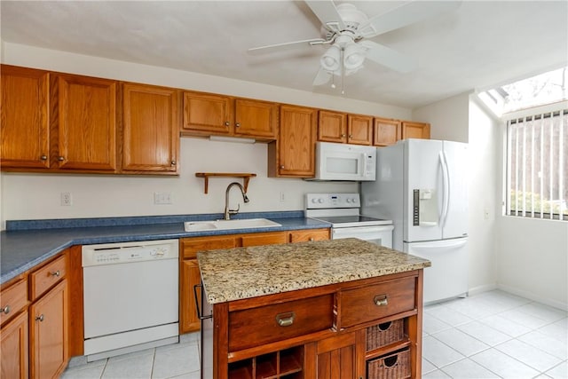 kitchen with light tile patterned floors, white appliances, a sink, brown cabinets, and open shelves