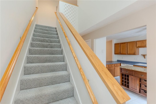 staircase with tile patterned flooring