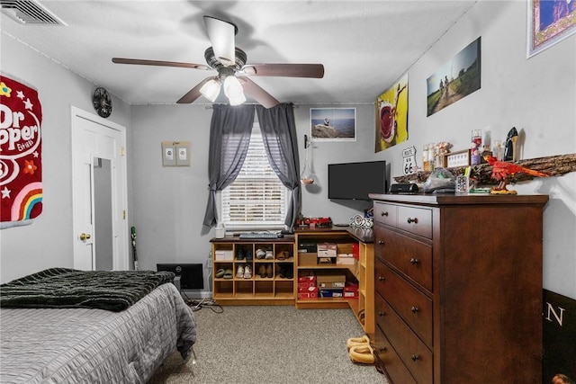 bedroom with ceiling fan, carpet, and visible vents