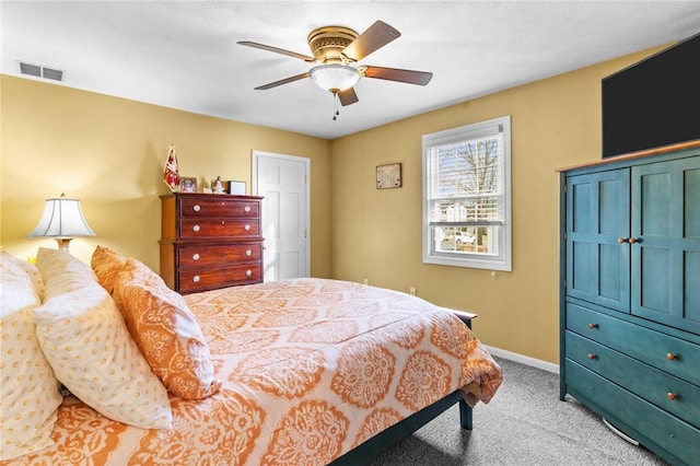 bedroom with visible vents, ceiling fan, light carpet, and baseboards