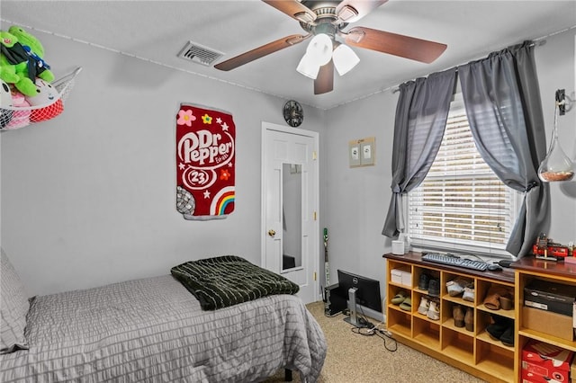 bedroom with visible vents and a ceiling fan