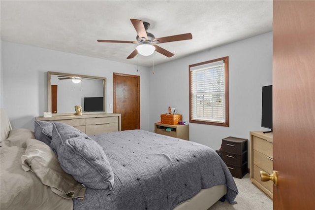 bedroom featuring ceiling fan and light colored carpet