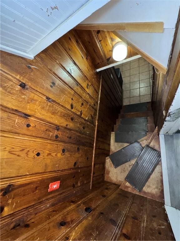 stairs with wood walls