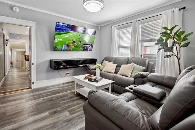 living area with baseboards and wood finished floors