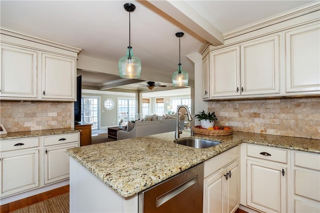 kitchen featuring decorative backsplash, dishwasher, a peninsula, a sink, and beam ceiling