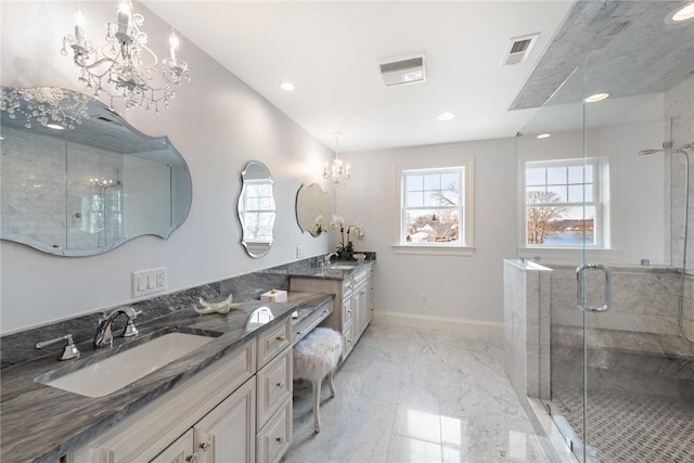 bathroom with marble finish floor, visible vents, a notable chandelier, and a shower stall