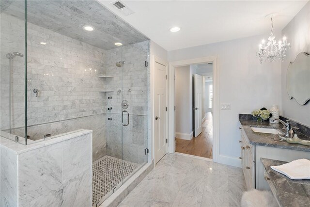 1040 Buttonwoods Ave, Warwick, RI 02886 - full bath featuring a shower stall, marble finish floors, vanity, a chandelier, and baseboards