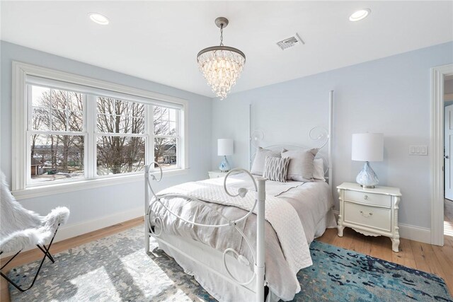 1040 Buttonwoods Ave, Warwick, RI 02886 - bedroom with a chandelier, light wood-style floors, baseboards, and recessed lighting