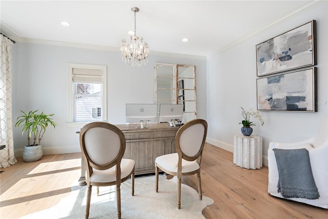 office area featuring light wood-type flooring, crown molding, and baseboards