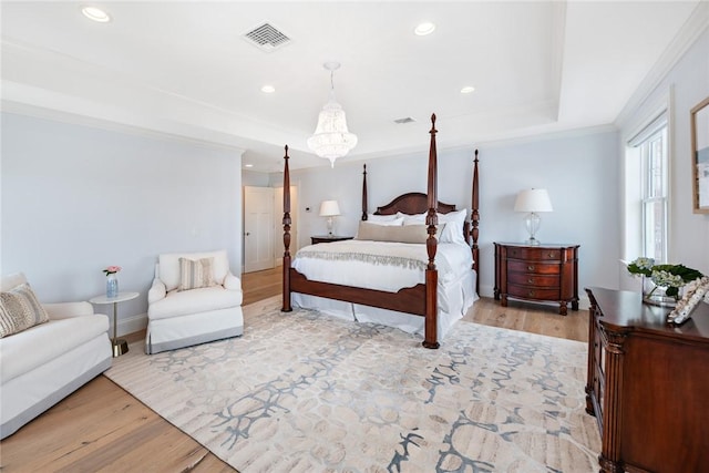 1040 Buttonwoods Ave, Warwick, RI 02886 - bedroom featuring light wood finished floors, recessed lighting, crown molding, baseboards, and a raised ceiling