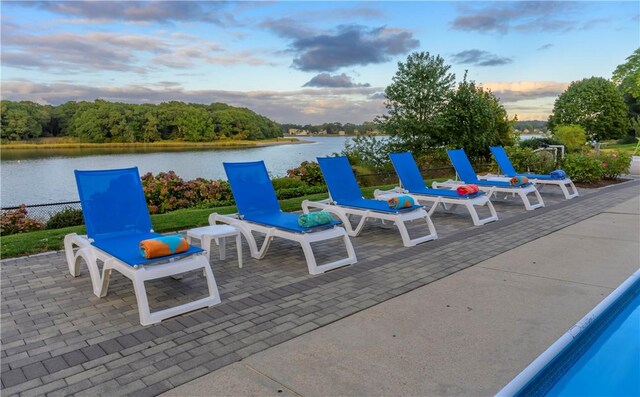 1040 Buttonwoods Ave, Warwick, RI 02886 - patio terrace at dusk with a water view and a patio area