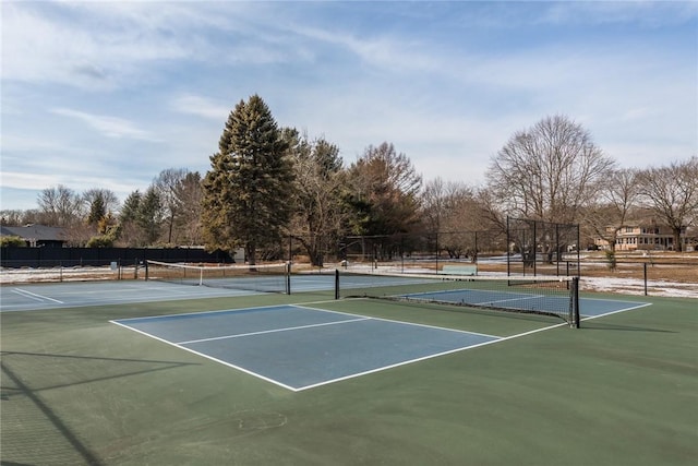 view of tennis court with fence