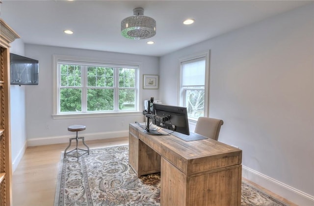 office area with light wood-style floors, recessed lighting, and baseboards