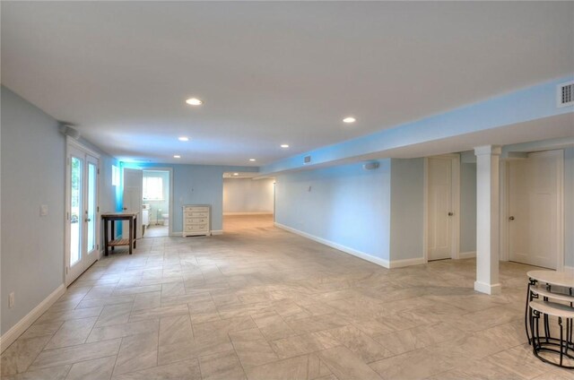 1040 Buttonwoods Ave, Warwick, RI 02886 - unfurnished living room featuring baseboards, recessed lighting, and ornate columns