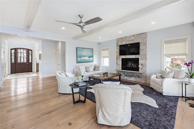 1040 Buttonwoods Ave, Warwick, RI 02886 - living room featuring beamed ceiling, a ceiling fan, light wood-type flooring, a fireplace, and recessed lighting