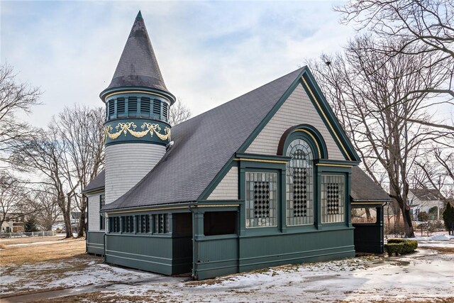 1040 Buttonwoods Ave, Warwick, RI 02886 - view of snowy exterior with roof with shingles
