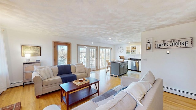 living room with french doors, a textured ceiling, light wood-style floors, and a baseboard radiator