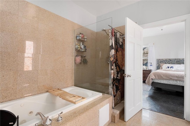 ensuite bathroom featuring a tub with jets, walk in shower, and ensuite bathroom