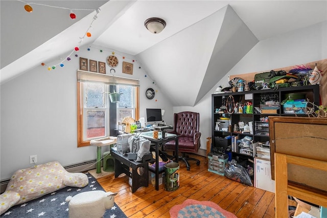 office area with vaulted ceiling, a baseboard radiator, and hardwood / wood-style flooring