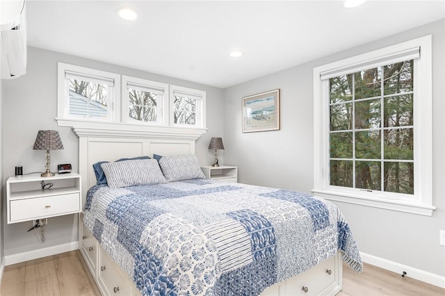 bedroom featuring light wood-type flooring, baseboards, and recessed lighting