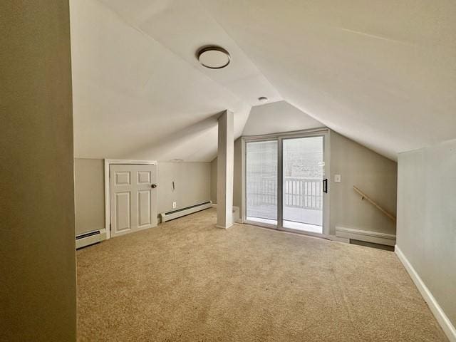 bonus room with carpet, a baseboard heating unit, and vaulted ceiling