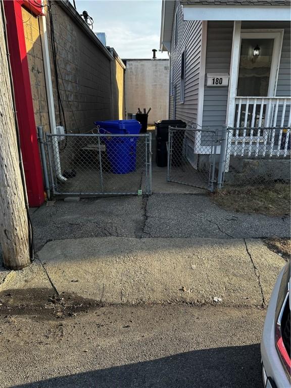 view of home's exterior featuring a gate