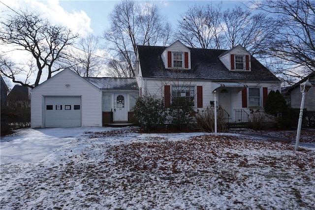 cape cod-style house with concrete driveway and an attached garage