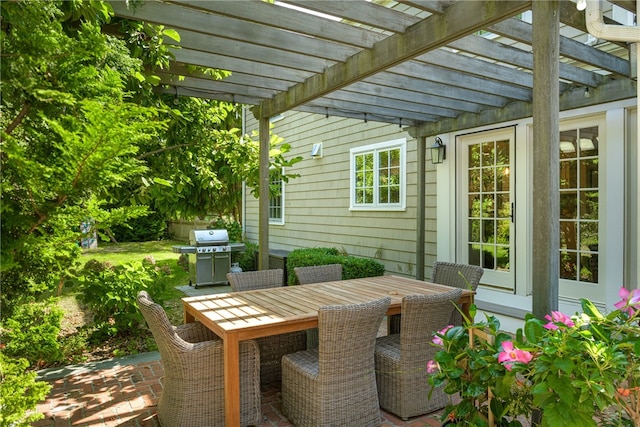 view of patio / terrace with outdoor dining space, area for grilling, and a pergola