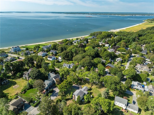 drone / aerial view with a residential view and a water view