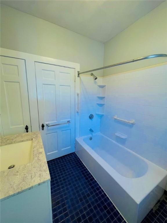 full bathroom with tile patterned flooring, vanity, and shower / bathtub combination