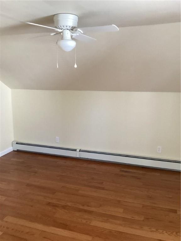 bonus room featuring lofted ceiling, a baseboard heating unit, wood finished floors, and a ceiling fan