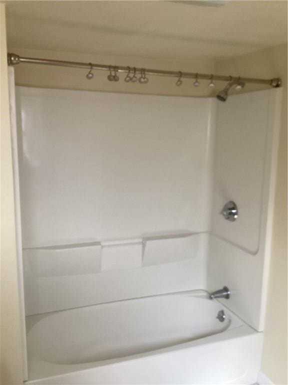 bathroom with shower / tub combination