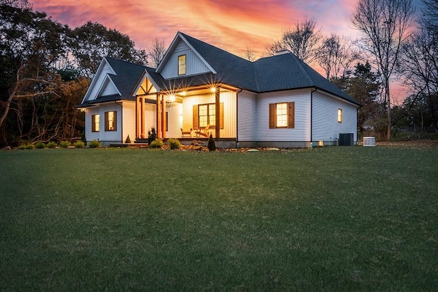 modern farmhouse style home featuring a front yard and covered porch