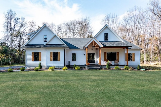 modern farmhouse style home featuring a shingled roof, a porch, and a front yard