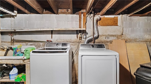 washroom featuring laundry area and separate washer and dryer