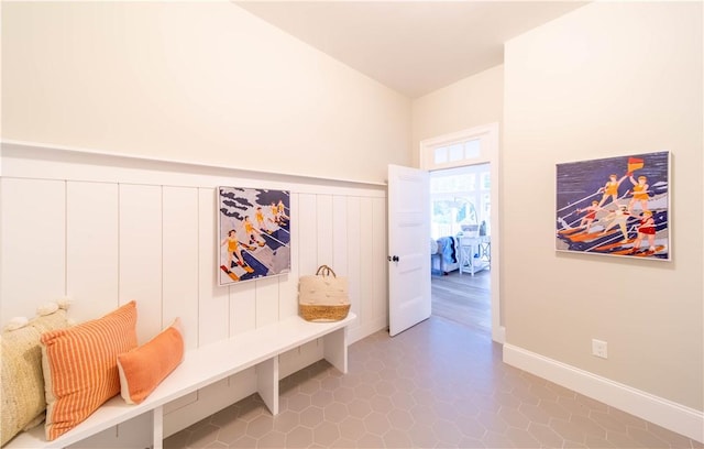 168 Explorer Dr, North Kingstown, RI 02874 - mudroom featuring a wainscoted wall and tile patterned flooring