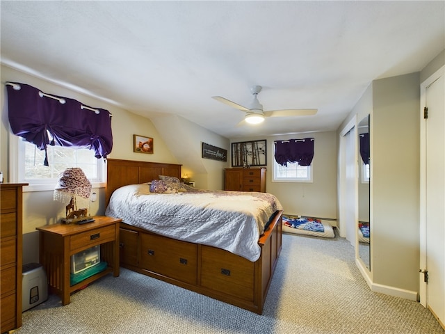 bedroom with light carpet and ceiling fan