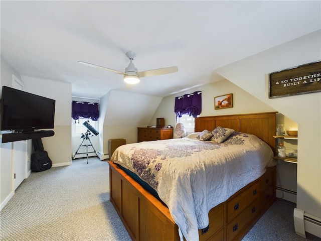 bedroom featuring multiple windows, a baseboard heating unit, and light colored carpet