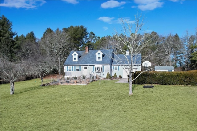 view of front of house with a chimney and a front yard