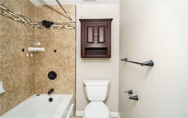 full bathroom with toilet, baseboards, and bathing tub / shower combination