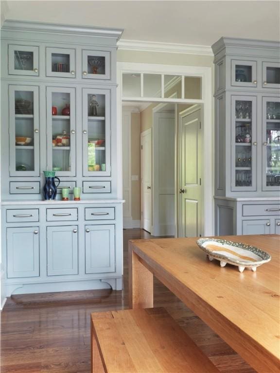 mudroom featuring ornamental molding and wood finished floors