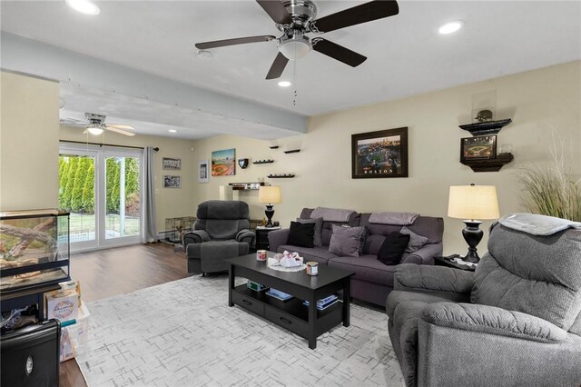 living area featuring a ceiling fan, wood finished floors, and recessed lighting