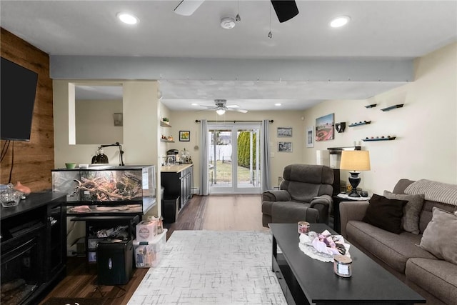 living area with a ceiling fan, recessed lighting, and wood finished floors